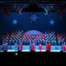 The Children's Choir lends its voice to the Christmas Cantata beneath gigantic boughs of holly.
