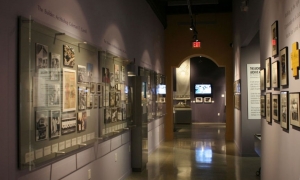 Even this narrow hallway became exhibit display space. Custom wall displays, designed by AST, showcase various historical photos.
