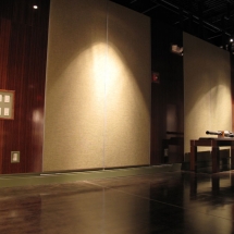 To "dress up" bare walls in an undeveloped section of the museum, AST Exhibits built and installed large decorative panels of fabric and bamboo plywood.