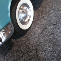 The tires were filled with foam to prevent them from going flat. AST Exhibits designed a special graphic for the floor that resembles asphalt cracking in the hot Florida sun.