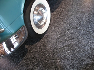 The tires were filled with foam to prevent them from going flat. AST Exhibits designed a special graphic for the floor that resembles asphalt cracking in the hot Florida sun.