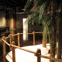 The rustic cypress structures of the Calusa stand in stark contrast to the glossy wood finishes seen across the room in the "soon to be built" exhibit featuring Spanish Exploration.