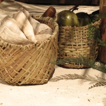 Hand-woven baskets made from local grasses were commissioned by AST Exhibits to complete this scene.