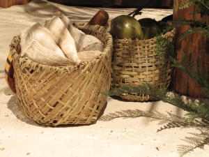 Hand-woven baskets made from local grasses were commissioned by AST Exhibits to complete this scene.