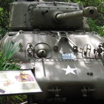 The positioning of an outdoor sign can be impactful. You cannot read this graphic without staring down the "business end" of a Sherman Tank.