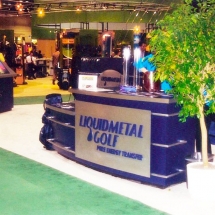 Traditional elements of trade show kiosks, like this desk, were updated and given a modern appearance.