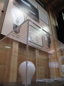 This simple interactive display shows the power that can be saved by using fluorescent light bulbs.